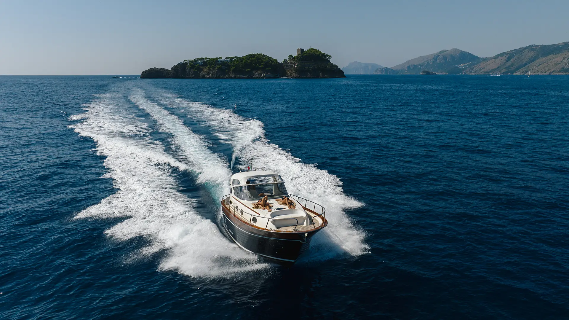 Relaxing on the bow of the Apreamare 38 while cruising along the Amalfi Coast