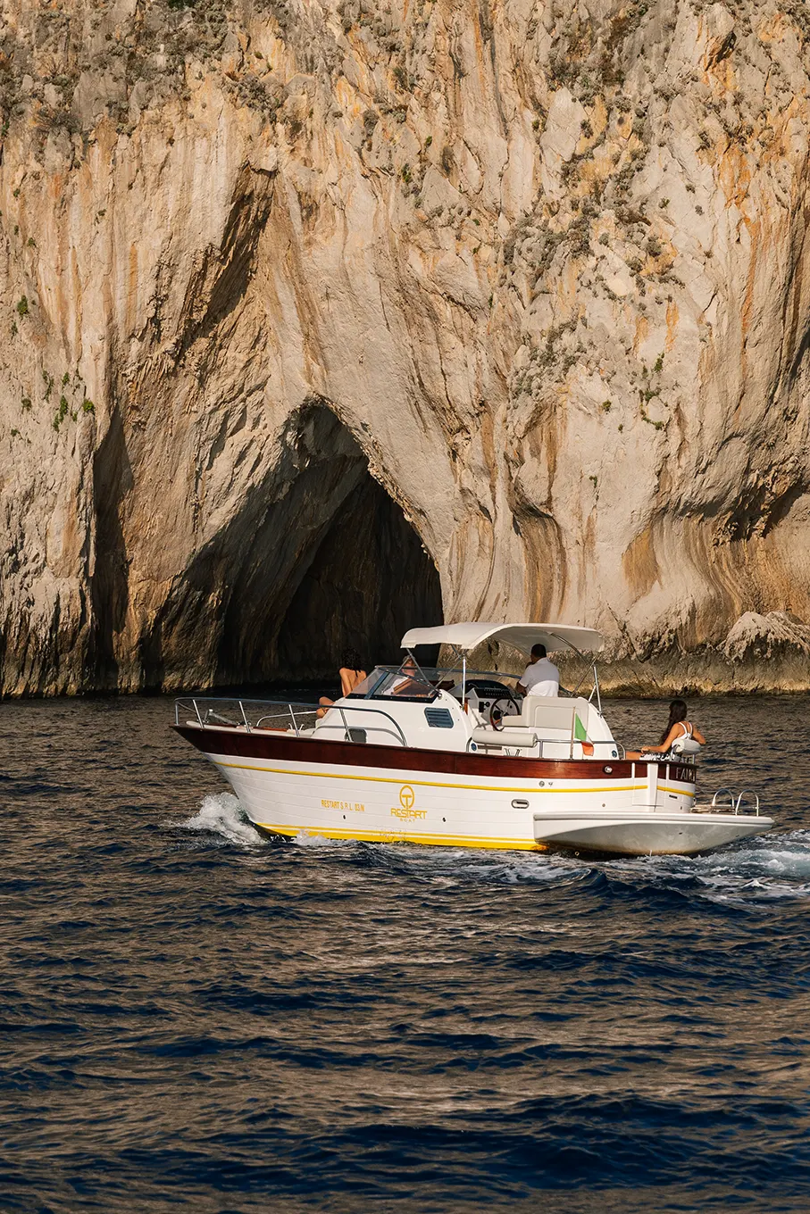 Family enjoying a private boat excursion along the Capri coastline