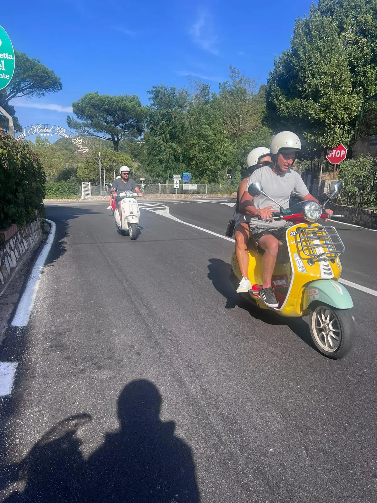 Young travelers on Vespa exploring the Amalfi Coast