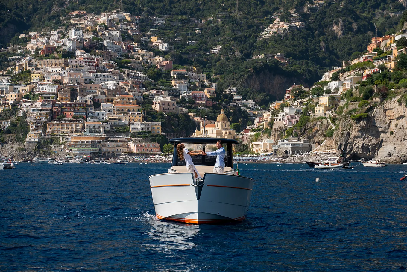 Couple enjoying a private boat tour to Positano