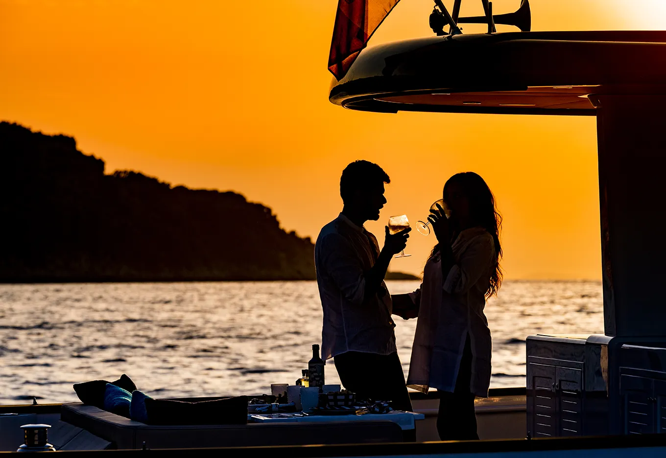 Couple toasting during a private sunset boat tour in Sorrento