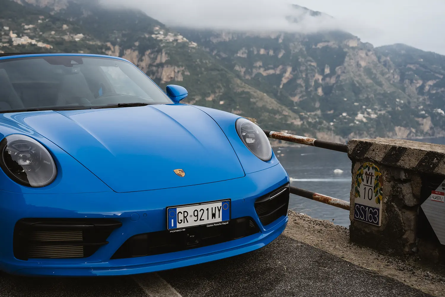 Detail of Porsche 911 with Positano in the background