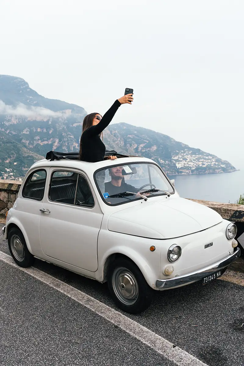 Guests enjoying a photo tour in a Fiat 500