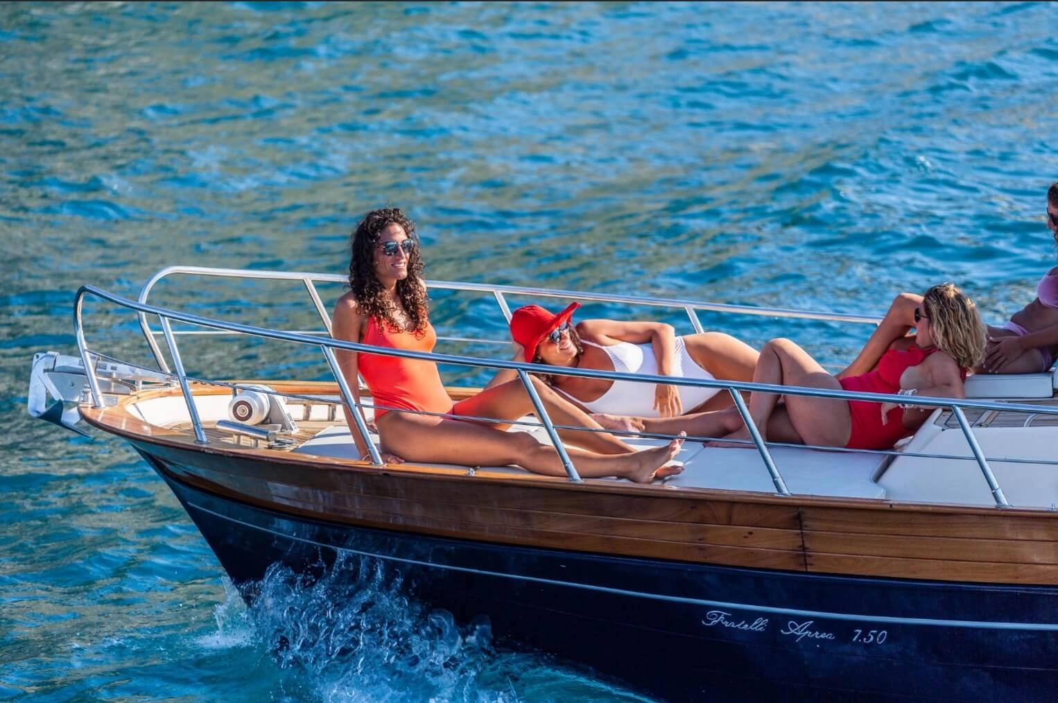 Friends having fun and relaxing together during a boat tour