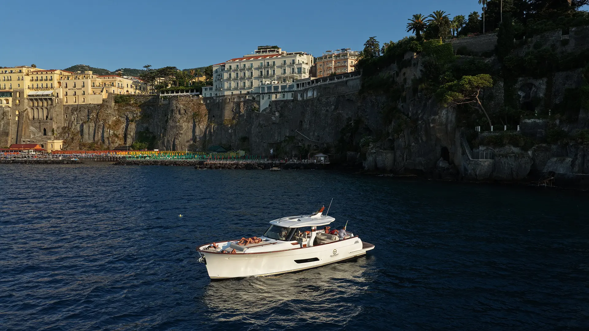 Lancia Aprea 52 anchored off Sorrento with guests relaxing on board