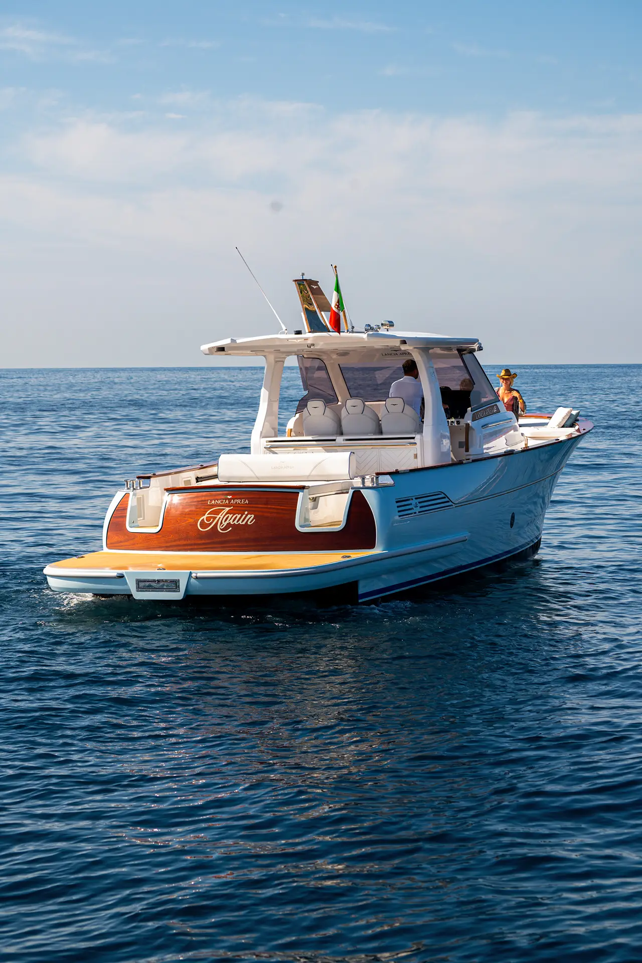 Guests on the bow of the Lancia 42 during a day of cruising